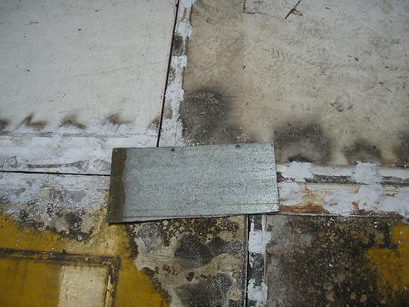 Metal plates to stop corners of floor lifting.jpg